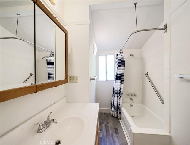 full bathroom featuring vanity, shower / bathtub combination with curtain, and wood finished floors