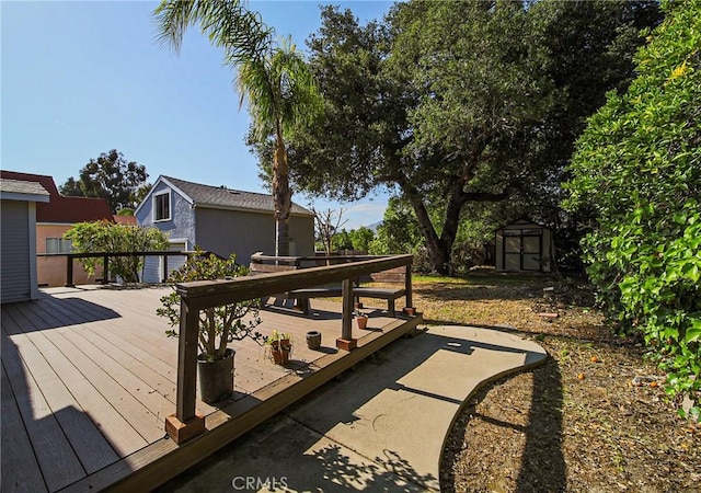 deck with a storage shed and an outdoor structure