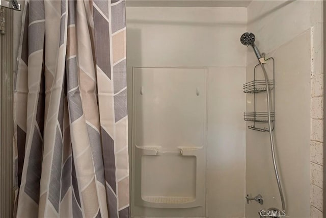 bathroom featuring curtained shower