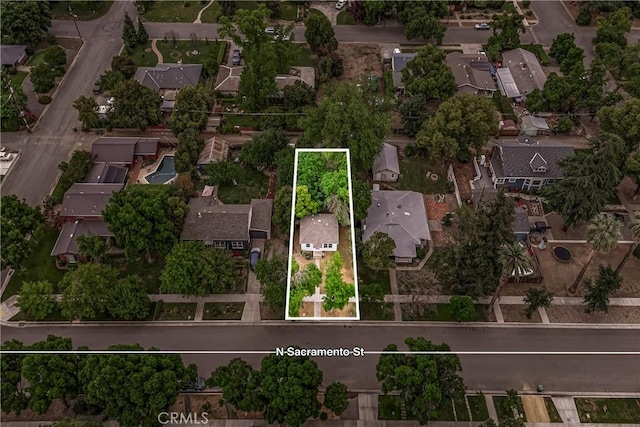 birds eye view of property with a residential view