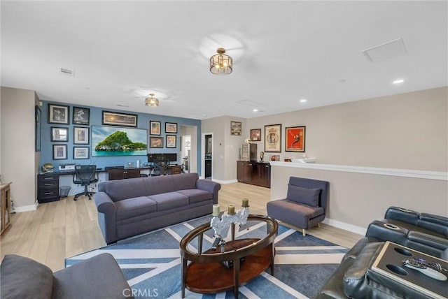 13504 Planet Ct, Riverside, CA 92503 - living area featuring a desk, light wood-type flooring, baseboards, and recessed lighting