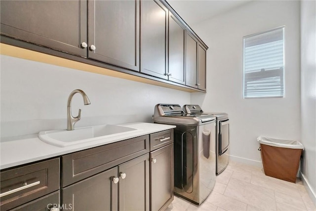13504 Planet Ct, Riverside, CA 92503 - laundry room with cabinet space, independent washer and dryer, and baseboards