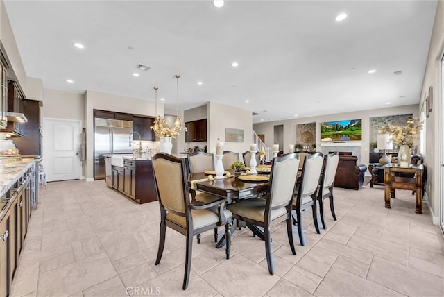13504 Planet Ct, Riverside, CA 92503 - dining space featuring recessed lighting and a chandelier