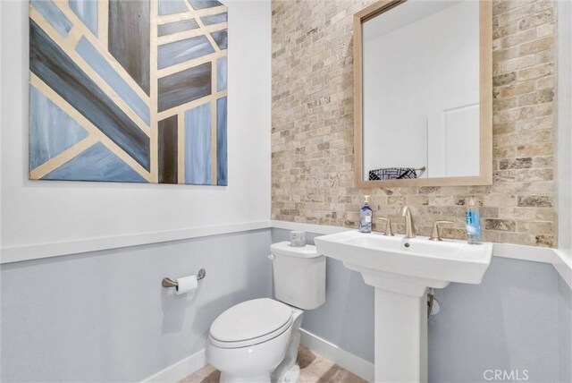 13504 Planet Ct, Riverside, CA 92503 - bathroom featuring toilet and baseboards