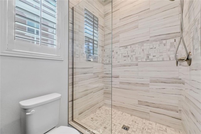 13504 Planet Ct, Riverside, CA 92503 - bathroom featuring a shower stall and toilet