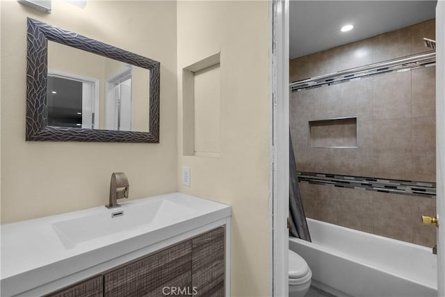 bathroom with recessed lighting, vanity, toilet, and tub / shower combination