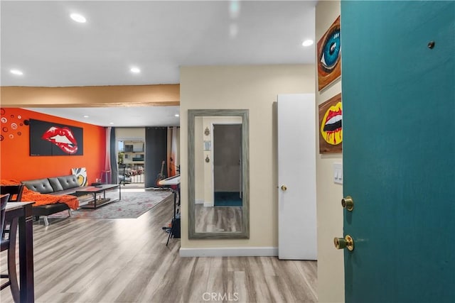 interior space with recessed lighting, baseboards, and wood finished floors