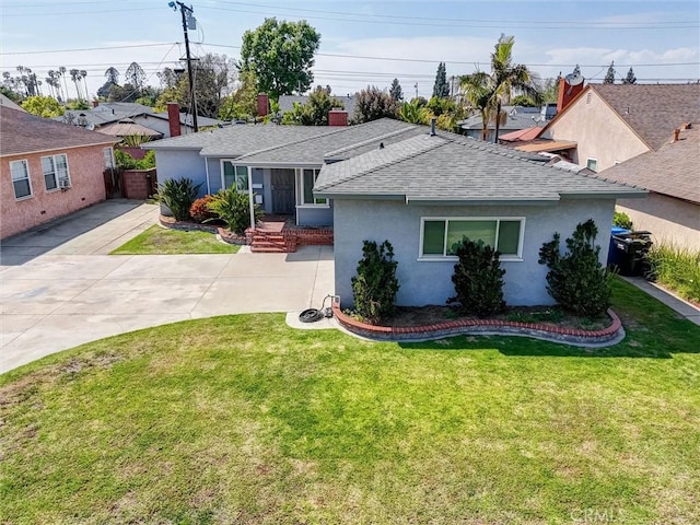 ranch-style house featuring fence, a front yard, stucco siding, a chimney, and a shingled roof