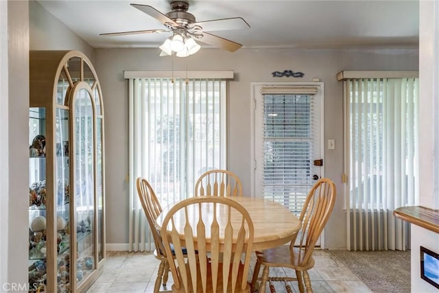 dining space with a ceiling fan and plenty of natural light