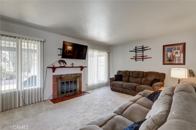 carpeted living room with a brick fireplace