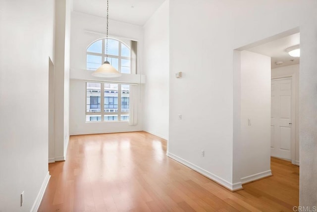1465 C St Unit 3604, San Diego, CA 92101 - empty room with light wood-style flooring and a high ceiling