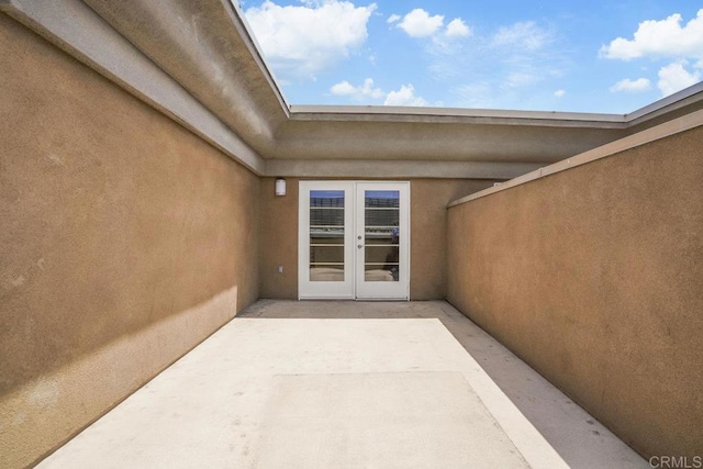 1465 C St Unit 3604, San Diego, CA 92101 - property entrance featuring french doors, a patio area, and stucco siding