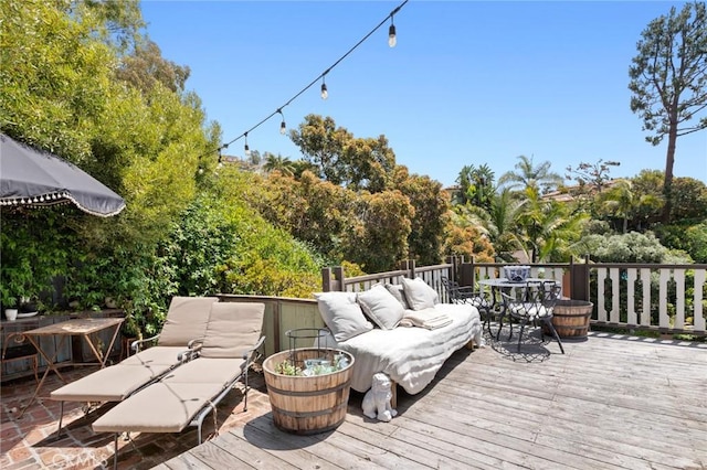 wooden terrace featuring an outdoor hangout area