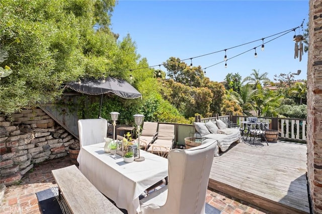deck featuring outdoor dining space and outdoor lounge area