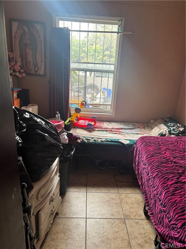 bedroom featuring light tile patterned floors