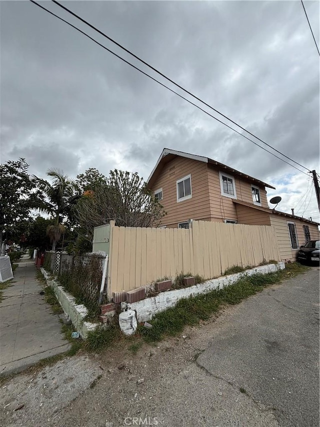 view of side of property with fence