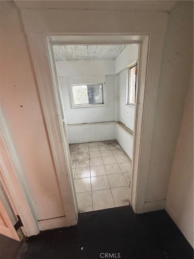 hallway with light tile patterned floors