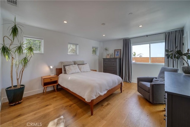 bedroom with visible vents, recessed lighting, baseboards, and light wood-type flooring