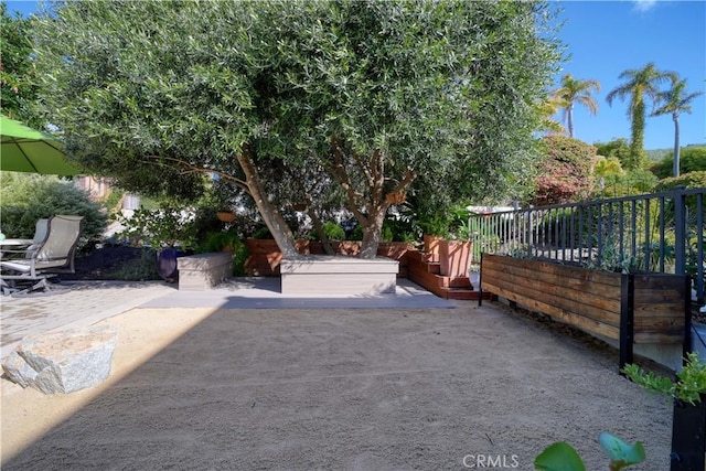 view of patio featuring fence