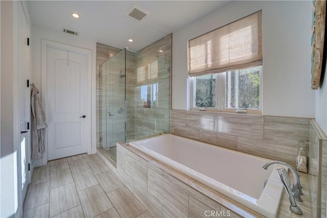 full bath with visible vents, recessed lighting, a bath, and a shower stall