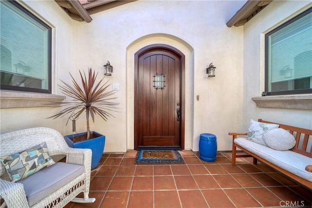 doorway to property with stucco siding