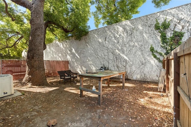 view of yard featuring a patio and fence