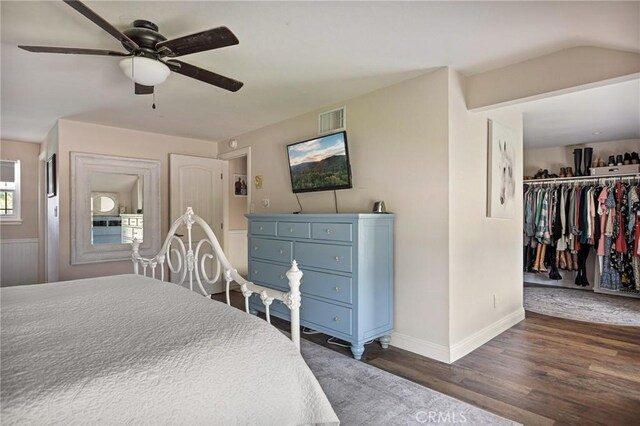 11414 Golden Gate Dr, Yucaipa, CA 92399 - bedroom featuring dark wood-style flooring, baseboards, ceiling fan, a walk in closet, and a closet