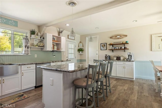 kitchen featuring wood finished floors, open shelves, stone countertops, and dishwasher