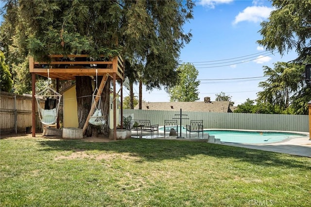 view of yard with a patio, a fenced in pool, and a fenced backyard