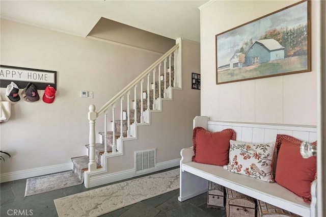 stairs featuring visible vents and baseboards