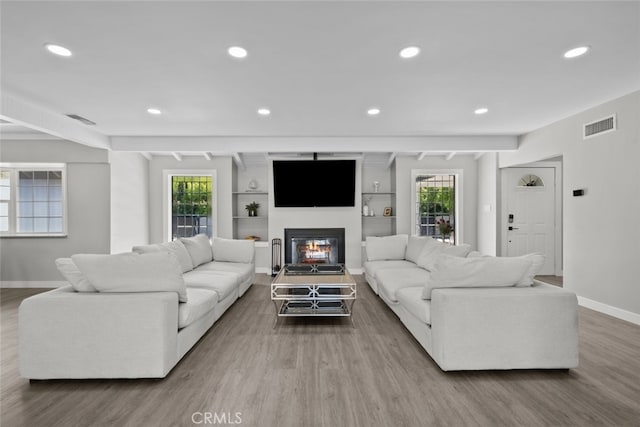 17441 Rayen St, Sherwood Forest, CA 91325 - living room featuring visible vents, beam ceiling, wood finished floors, baseboards, and recessed lighting