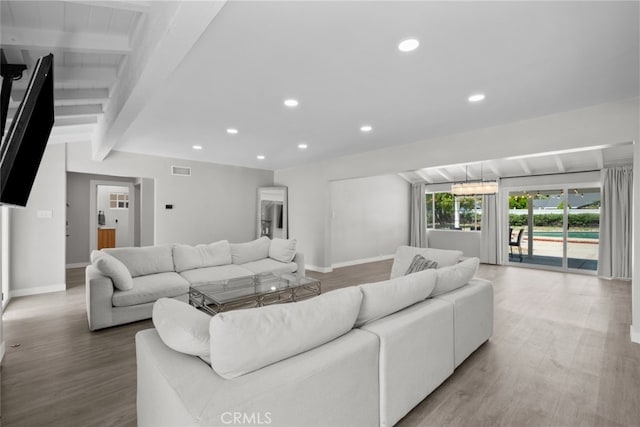 17441 Rayen St, Sherwood Forest, CA 91325 - living room with baseboards, visible vents, beam ceiling, and wood finished floors