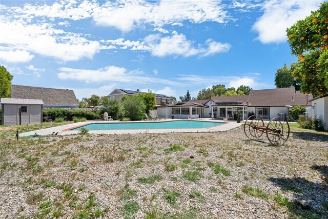 17441 Rayen St, Sherwood Forest, CA 91325 - pool featuring an outdoor structure, a shed, and a patio