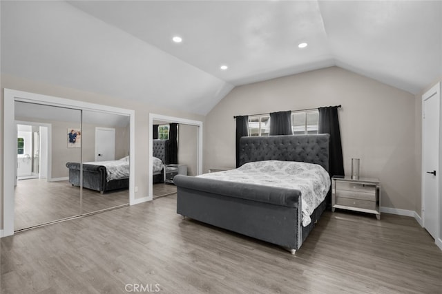 17441 Rayen St, Sherwood Forest, CA 91325 - bedroom with multiple closets, recessed lighting, baseboards, wood finished floors, and vaulted ceiling
