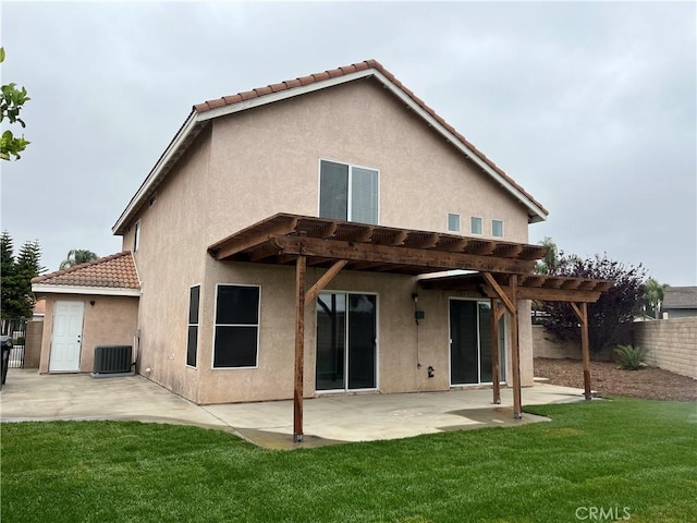 back of property with fence, a patio, a pergola, a tiled roof, and a lawn