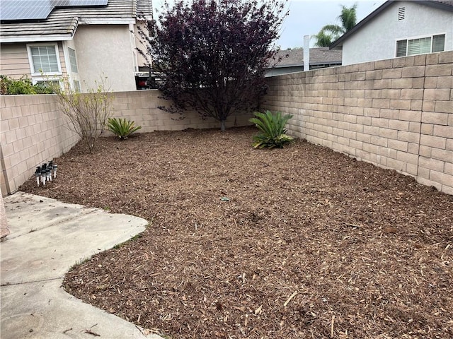 view of yard with a patio and a fenced backyard