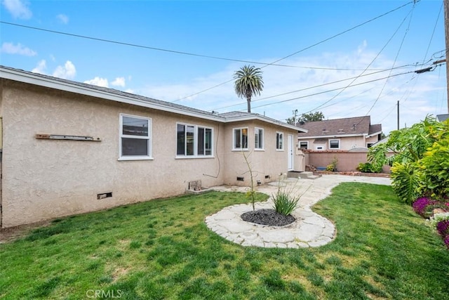 18012 Falda Ave, Torrance, CA 90504 - back of house featuring a lawn, stucco siding, crawl space, and fence