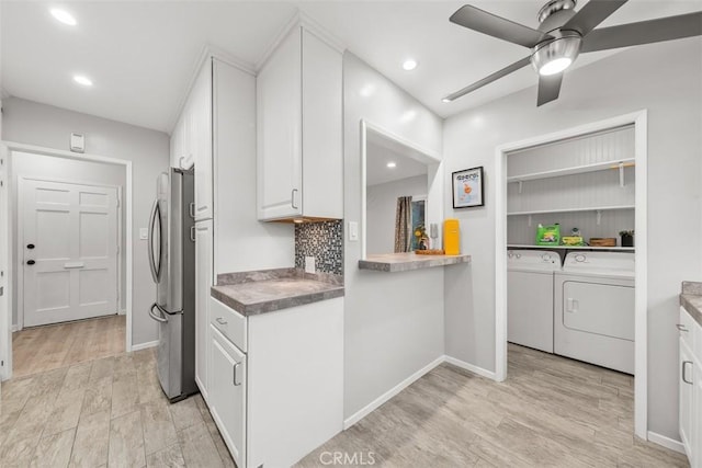 18012 Falda Ave, Torrance, CA 90504 - kitchen with ceiling fan, washing machine and clothes dryer, baseboards, white cabinets, and freestanding refrigerator