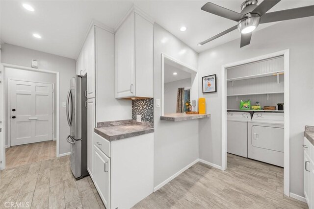18012 Falda Ave, Torrance, CA 90504 - kitchen with freestanding refrigerator, washing machine and clothes dryer, white cabinetry, a ceiling fan, and light wood-style flooring