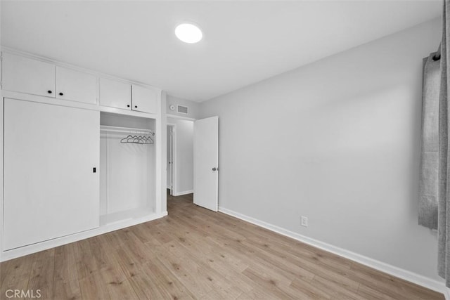 18012 Falda Ave, Torrance, CA 90504 - unfurnished bedroom with light wood-style floors, baseboards, visible vents, and a closet