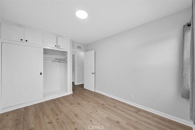 18012 Falda Ave, Torrance, CA 90504 - unfurnished bedroom with light wood-style flooring and a closet