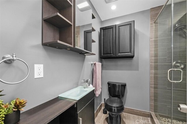 18012 Falda Ave, Torrance, CA 90504 - bathroom with a shower stall, vanity, and wood finished floors