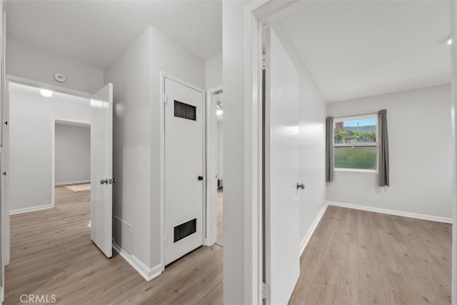 18012 Falda Ave, Torrance, CA 90504 - corridor with baseboards, visible vents, and light wood-style floors