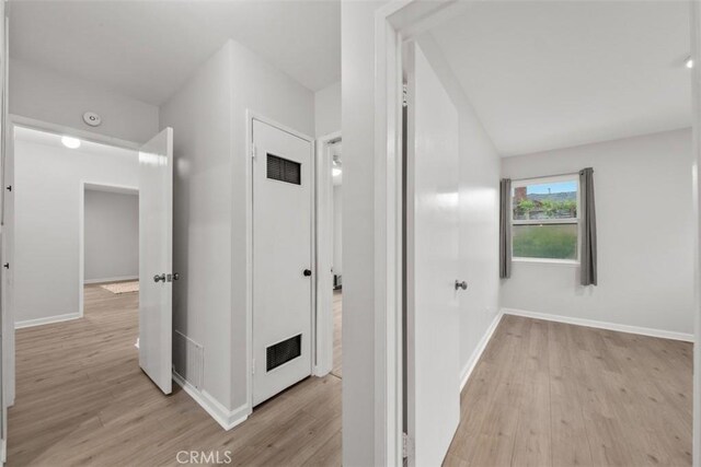 18012 Falda Ave, Torrance, CA 90504 - hallway with light wood finished floors and vaulted ceiling