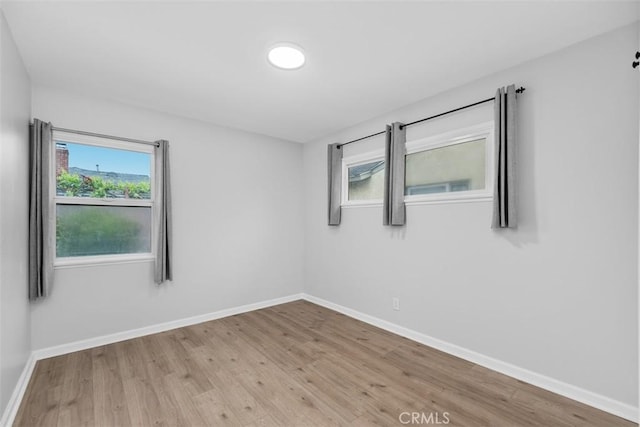 18012 Falda Ave, Torrance, CA 90504 - unfurnished room with wood finished floors and baseboards