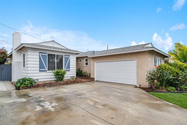 18012 Falda Ave, Torrance, CA 90504 - ranch-style house with concrete driveway, a garage, stucco siding, and a chimney