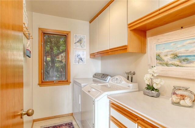 1660 Saint Thomas Ave, Cambria, CA 93428 - laundry room featuring cabinet space, washer and clothes dryer, baseboards, and light tile patterned floors