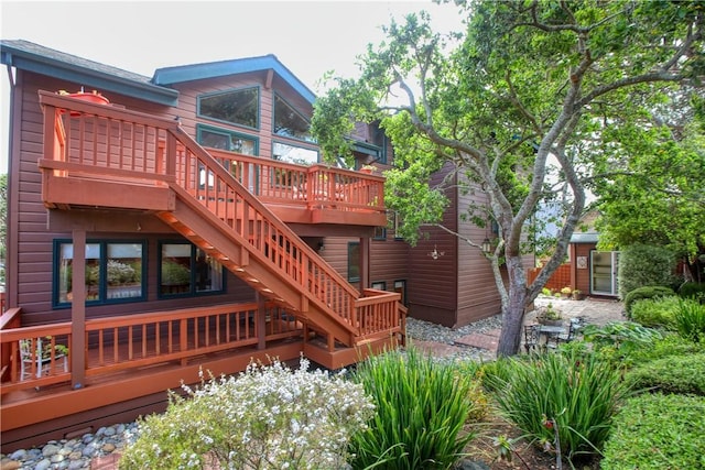 1660 Saint Thomas Ave, Cambria, CA 93428 - rear view of house featuring a wooden deck and stairway