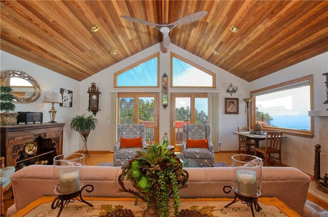 1660 Saint Thomas Ave, Cambria, CA 93428 - living area featuring baseboards, light wood finished floors, wood ceiling, and high vaulted ceiling