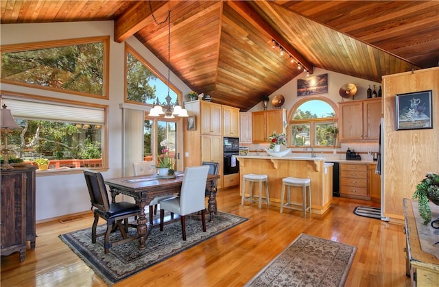 1660 Saint Thomas Ave, Cambria, CA 93428 - dining area with a chandelier, wood ceiling, beam ceiling, light wood-style floors, and high vaulted ceiling